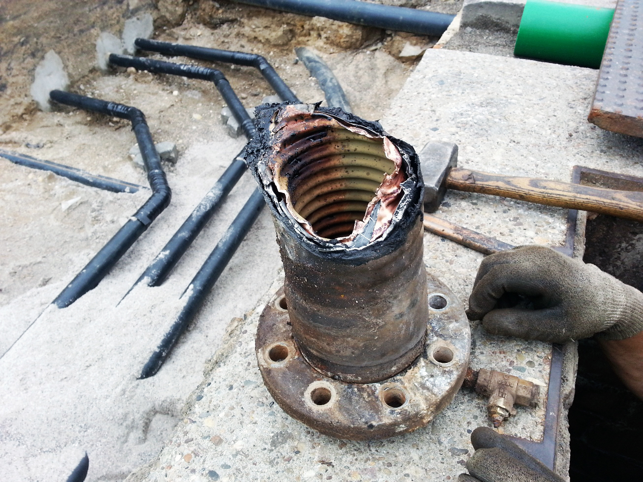 Previously installed corrugated steel and copper piping was damaged due to corrosion